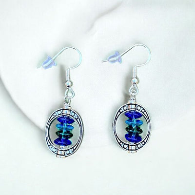 Handmade Oval frame and blue/green glass bead earrings.