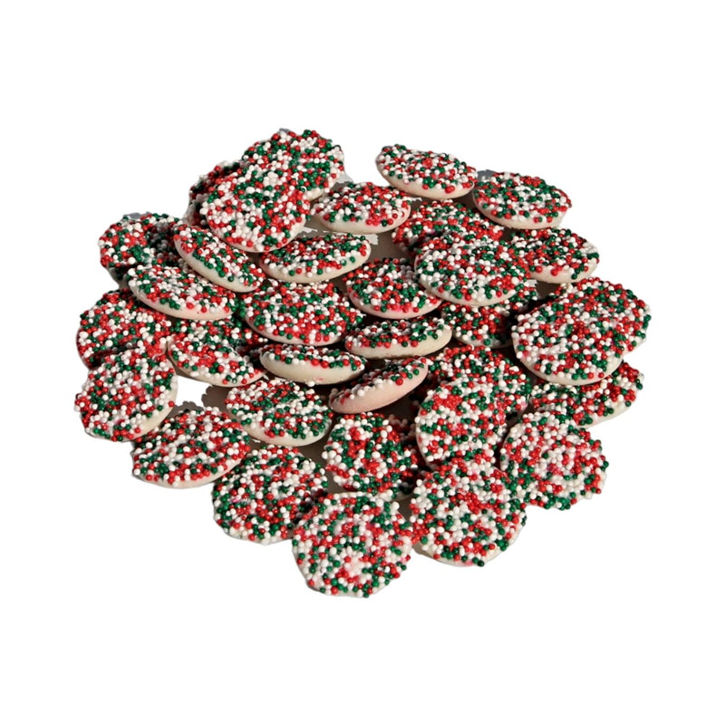 Red, green, and white sprinkles on top of Mint Drop Nonpareils