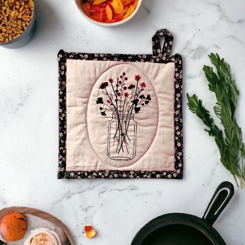 A pretty Embroidered Potholders/Hot Pad with a Jar of Flowers