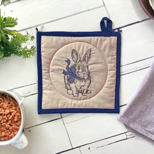 All or our Embroidered Potholders/Hot Pads, including this Rabbit with Blue Ribbon, are Made in the USA.