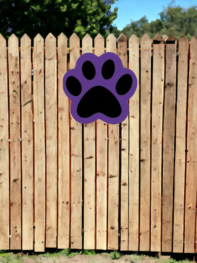 Purple and black door hanger shows that they can be hung on a wooden fence to spruce up your sports party decorations.