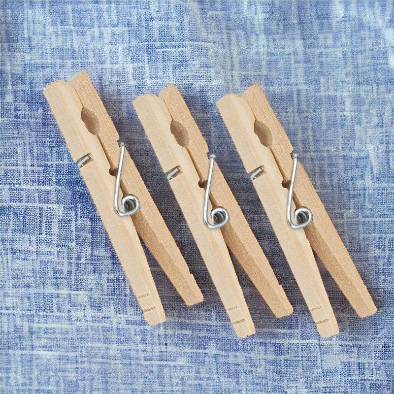 Closeup of 3 Large Wooden Clothespins