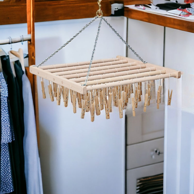 Large Hanging Clothespin rack includes 49 attached wooden clothespins and chain to hang it in the laundry room or outside.