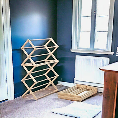 Our 36" Floor Standing Clothes Rack easily collapses for storage. Eco-friendly and Made in the USA.