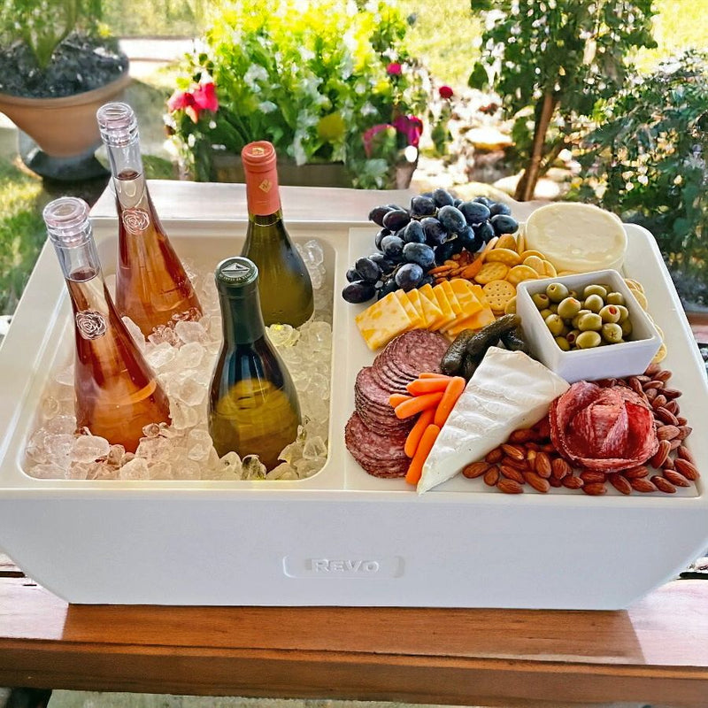 A beautiful spread of both wine, cheese, and meats for a lovely get-together with friends using one Chill Board and a REVO Dubler Cooler. 