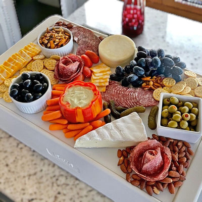 Both Chill Boards from REVO fit nicely on top of their Dubler Coolers to display an elegant array of charcuterie.