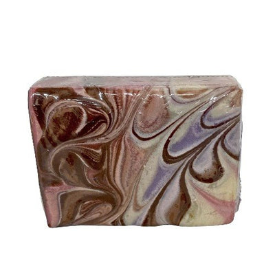 For our Hug Me Handmade Goats Milk Bar Soap, imagine a cozy brown sweater with pink and blue swirls in it.