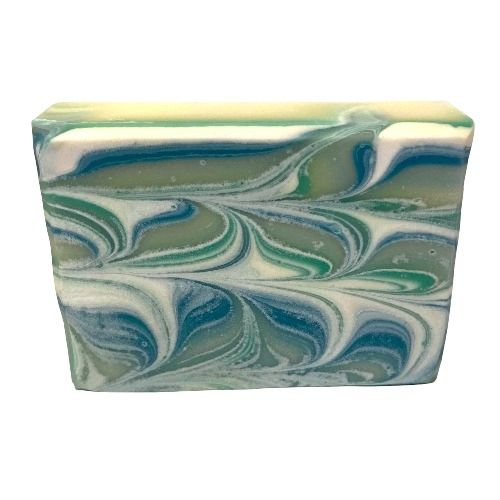 Peppermint and Pine scented Handmade Goats Milk Bar Soap has green, blue, sage, and white swirl patterns throughout.