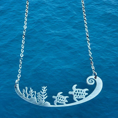 Two Sea Turtles Swimming Near Coral Stainless Steel Necklace at harvestarray.com