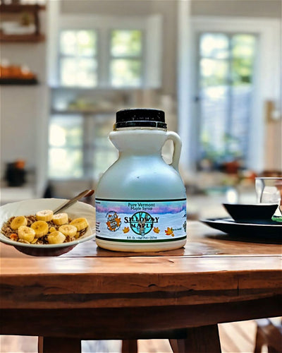 Silloway Maple's Pure Rich, Vermont Maple Syrup is delicious on oatmeal. pancakes, waffles, and more. Shown here in a giftable half pint jug!