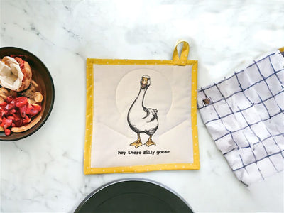 This cute Potholder has a Goose on it with the saying, "Hey there silly goose" embroidered on it.  The back is yellow with white polka dots.