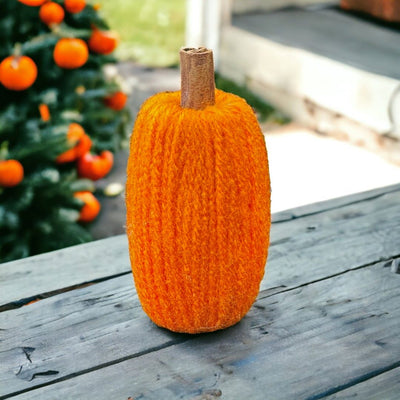 Small Orange Yarn Pumpkin with Cinnamon Stick Stem for indoor use only.