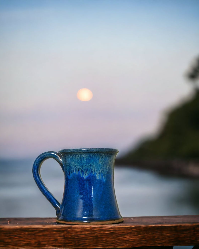Enjoy the view while drinking your morning coffee from a Fresh Awaking - Northern Lights Stoneware Mug from Harvest Array