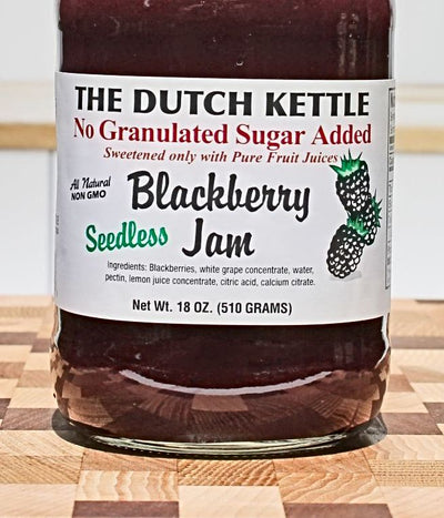 Close up of The Dutch Kettle Seedless, No Granulated Sugar Added Blackberry Jam to show ingredient list.