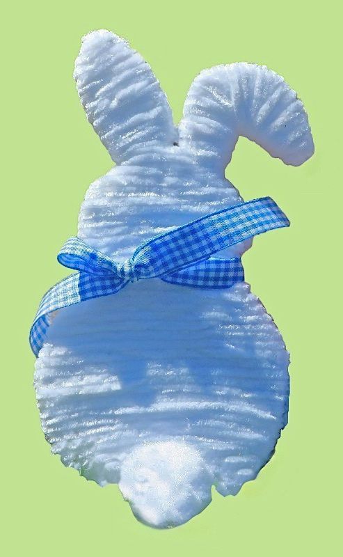 Handmade Easter and Spring Bunny Decoration crafted with white yarn, a cotton tail, and a blue and white check ribbon. Purchase now for Easter!