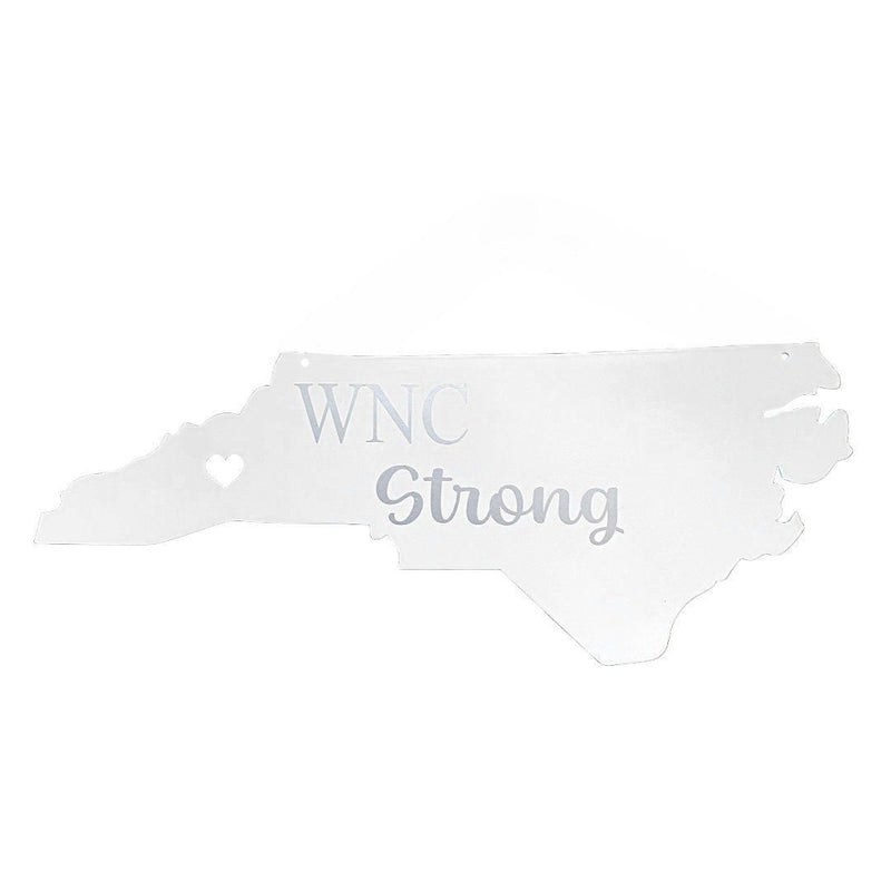White metal sign shaped like North Carolina with &