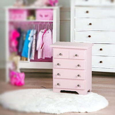 Doll Furniture - Pink Wooden Chest of Drawers in child's playroom.