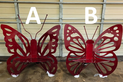 Two Designs of Small Metal Butterfly Benches. Design A has scalloped wings and large antennae. Design B has rounded wings and short antennae.