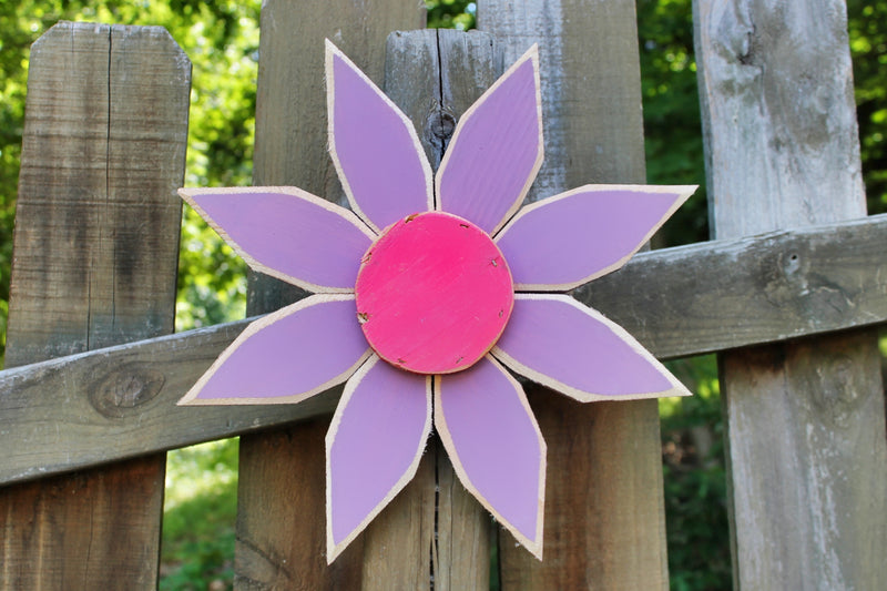 Purple and Pink Amish Made Wooden Flower Door Hanger shown on a fence Harvest Array