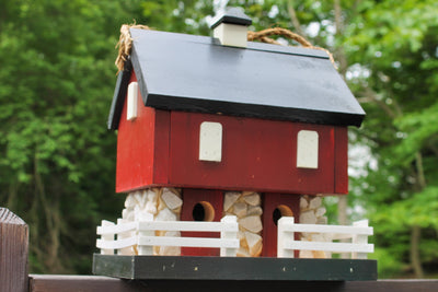 Side view of the Amish Made Red Barn Birdhouse from Harvest Array