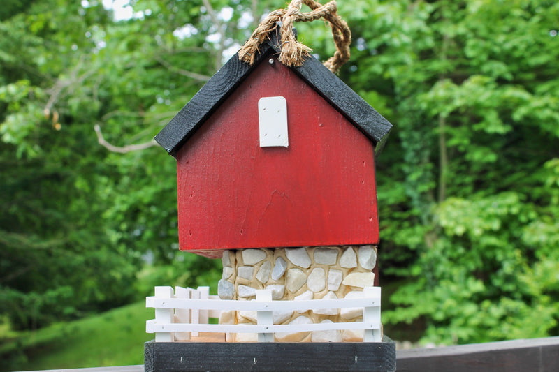 Side view of the Amish Made Red Barn Birdhouse from Harvest Array