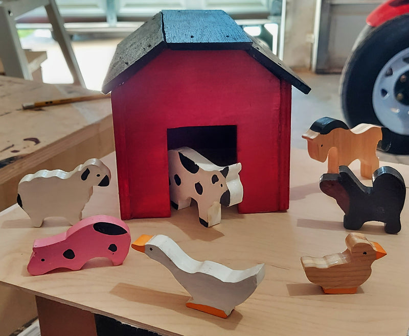 Handcrafted Wooden Barn with Farm Animals comes with a dog, goose, horse, cow, sheep, chicken, and pig.