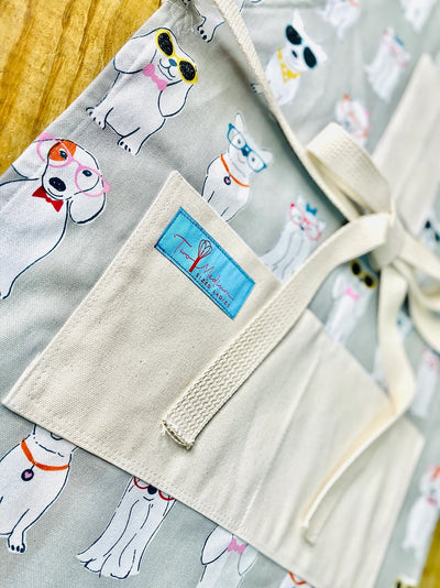 Close up of the Coco White Dog Print Apron