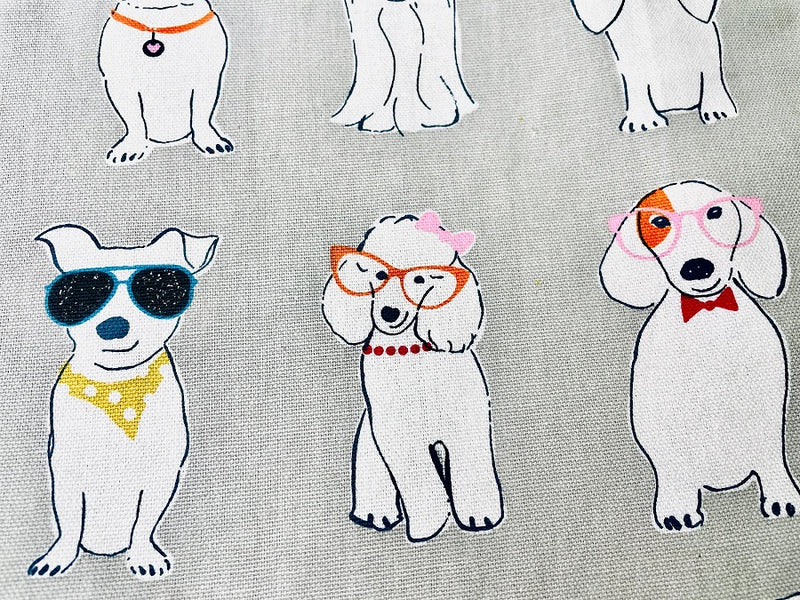 Material for the Coco White Dog Print Apron