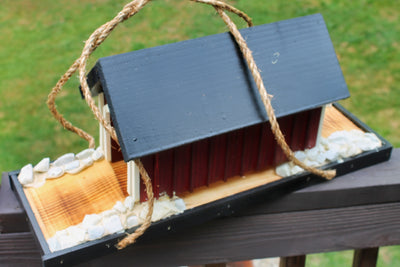 Side view of the Amish Made Covered Bridge Birdhouse from Harvest Array