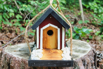 Amish Made Covered Bridge Birdhouse Outdoors on a Stump