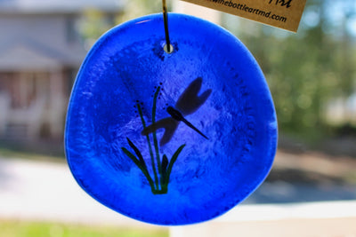 Dragonfly on blue glass 