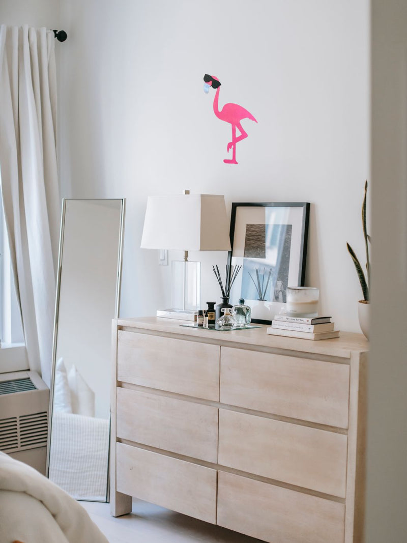 Groovy Flamingo Door/Wall Hanger hung on bedroom wall