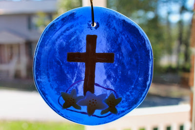 Gold cross on blue glass suncatcher