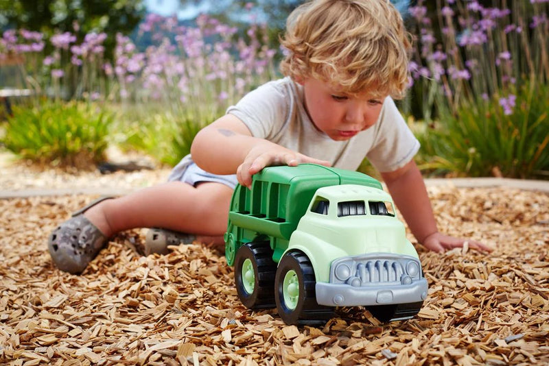 Small boy playing with the Recycling Truck 