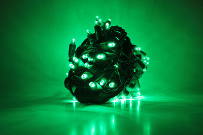 Outdoor LED Lighted Christmas Tree with Green Base and Orange and Purple Tree Lights