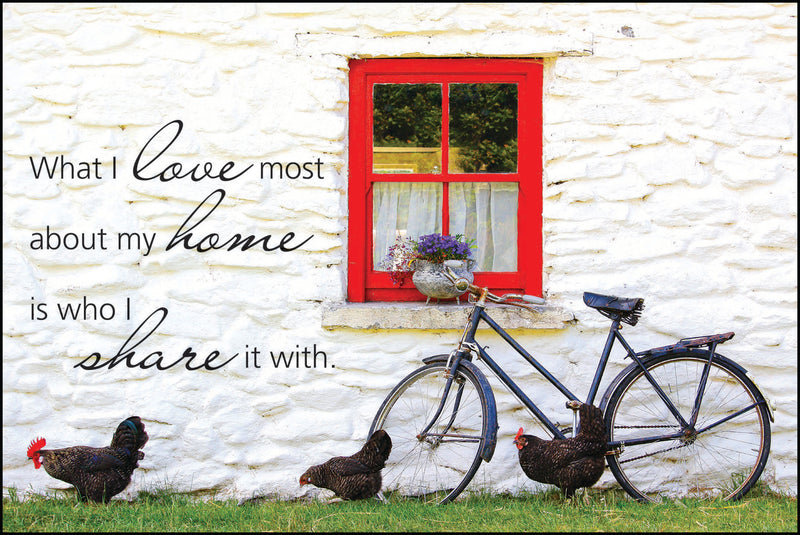 "What I love most about my home is who I share it with." with a window of a home, an old bicycle and chickens as the background.
