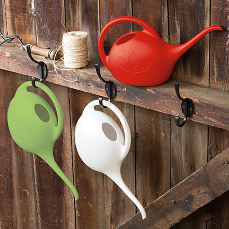Chose from Red, Pearl, Blue, and Green Half-Gallon Watering Cans. 