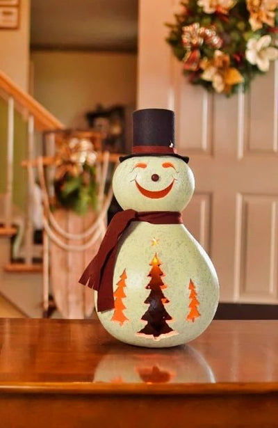 Plug in Easton the Extra Large Snowman Gourd and watch his jolly face and pretty trees illuminate!