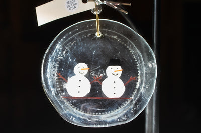 Mr. and Mrs. Snowman are hanging in your window