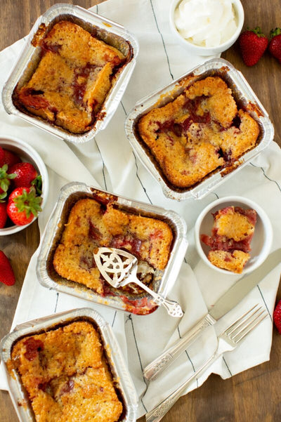 Individual strawberry cobblers in throw-away 3x5 foil pans using our Cobbler Mix for easy desserts.