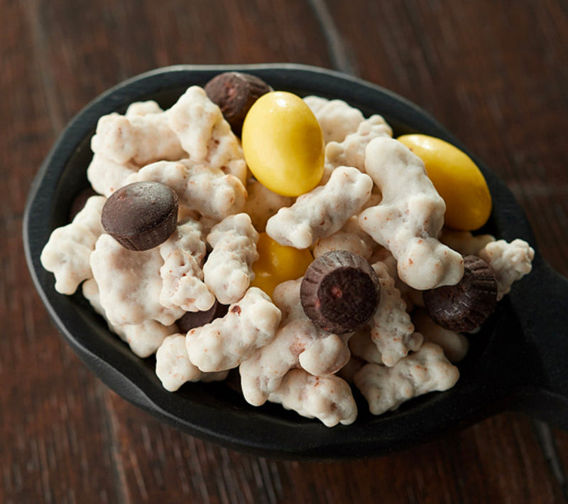A delicious handful of lemon coated pretzels and almonds with chocolate raspberry cups added.