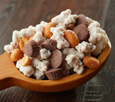 Delicious mini peanut butter cups, honey roasted peanuts, and peanut butter flavored confectioners coated pretzels make up this yummy Red Rocker Peanut Crunch Pretzel Mix on harvestarray.com.