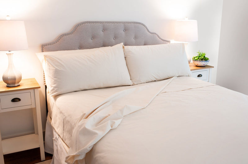 Bed made with American Blossom Linens cotton sheets made in the USA