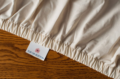 Cotton fitted sheet in natural color.