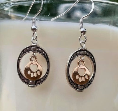 Oval Frame with Gold Toned Paw Print Charm Earrings on Harvest Array
