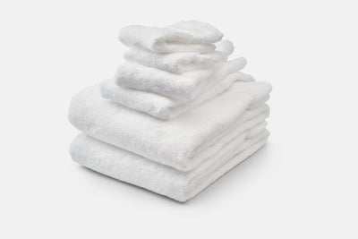 Six Piece Set of White Bath and Hand Towels Plus Washcloths. 
