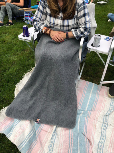 The Warmer Upper Lap Throw is for picnics and soccer
