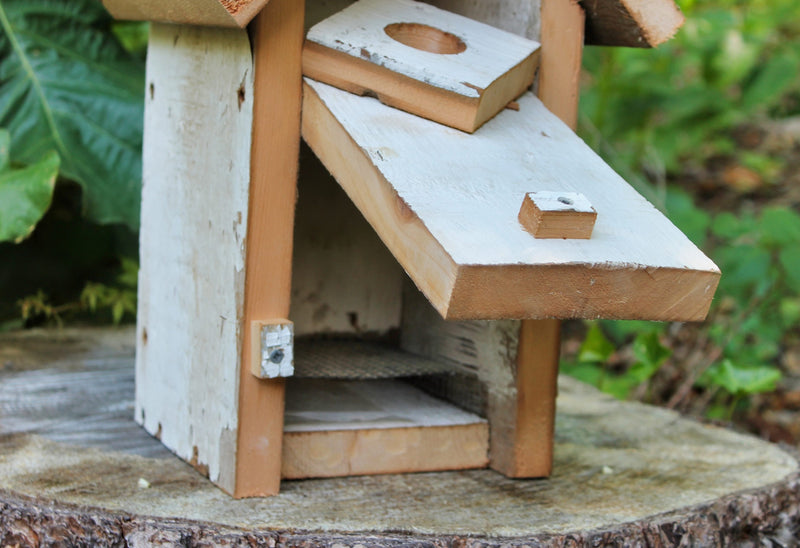 Close up of the White Peak Roof Blue Birdhouse