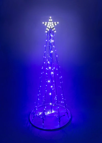 LED Lighted Pine Tree with White Base with Blue Tree Lights in the nighttime 