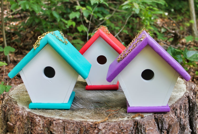 Three colors of Amish made Wren Birdhouses close up - purple, teal, and red